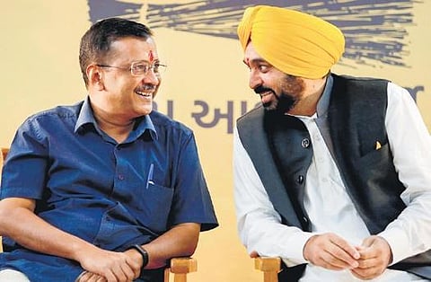 AAP chief Arvind Kejriwal and Punjab CM Bhagwant Mann at a gathering in Ahmedabad on Sunday| pti