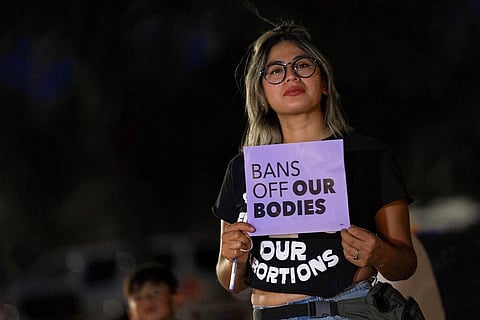 Celina Washburn protests outside the Arizona Capitol to voice her dissent with an abortion ruling. (File Photo | AP)