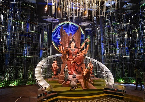 Kolkata is celebrating Durga Puja in full glory --- revellers wearing new clothes have started making the rounds of popular puja marquees which are already being inuagurated. The festival, dedicated to Goddess Durga, begins October 1 and ends on the 5th, which is celebrated as Dussehra --- a day to honour triumph of good over evil. (Photo | PTI)
