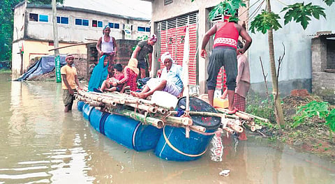 Laxman Mantry rescuing  villagers in his raft  | Express