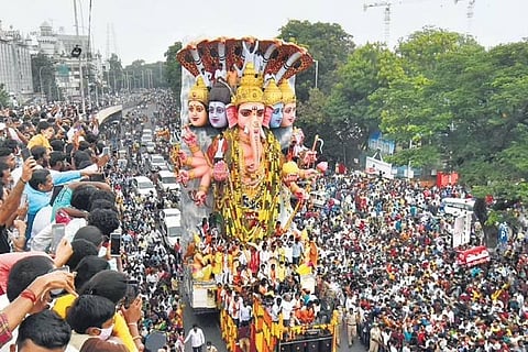 Devotees take the 40-foot-tall Khairathabad Ganesh idol for immersion in Hussainsagar in Hyderabad. (File Photo | S Senbagapandiyan, EPS)