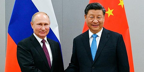Russia President Vladimir Putin (L) with his Chinese counterpart Xi Jinping (File photo | AP)