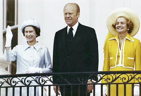 Queen Elizabeth II, left, waves from the balcony of the White House, in Washington as she stands with U.S. President Gerald Ford and first lady Betty Ford on July 7, 1976. (Photo | AP)