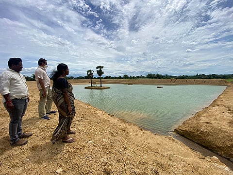DRDA Project Director A Lalitha inspecting a pond cut under Mission Amrit Sarovar  at Karai in Perambalur district | Express