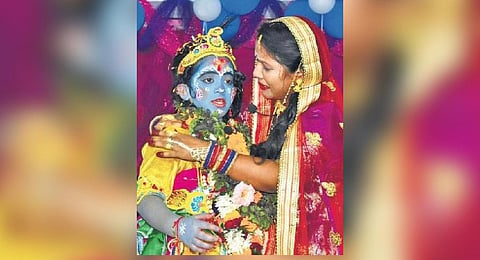 Actors playing Bal Krishna and Yashoda during Dhanuyatra in Bargarh | Express