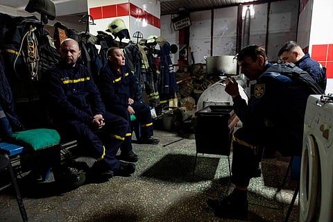 Ukrainian firefighters  in the city of Bakhmut, eastern Ukraine, on December 31, 2022. (Photo | AFP)