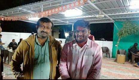 Harshad Gamot with BJP MLA Hardik Patel. (Photo | EPS)