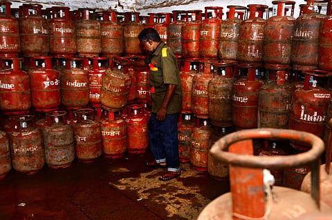 A man is seen sorting LPG cylinders at a distribution centre in Chennai. (File Photo | Debadatta Mallick, EPS)