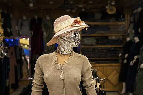 A mannequin's head is covered in a woman dress shop in Kabul (Photo | AP)