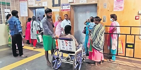 Patients and their attendants wait for the lift at RGGGH | P Jawahar