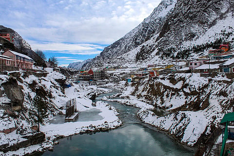 File photo of River Alaknanda flowing through snow-covered mountains at Badrinath in Chamoli district of Uttarakhand