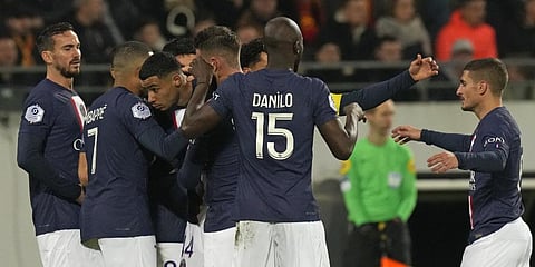 PSG's Hugo Ekitike, centre, celebrates after scoring his side's first goal during the French League One match between Lens and PSG.(Photo | AP)