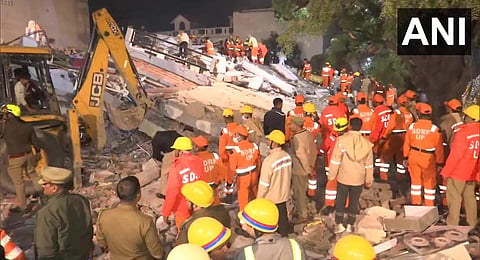 Rescue operation underway after a residential building collapsed on Wazir Hasanganj Road in Lucknow. (Photo | ANI Twitter)