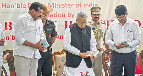 Governor Biswabhusan Harichandan during the release of the Telugu version of Exam Warriors at Raj Bhavan in Vijayawada on Tuesday I Prasant Madugula