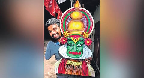 Sanoj Nadayil with one of his paintings. (Photo | Express)