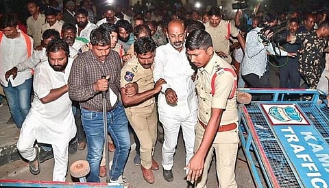 Police take away BJP State president Bandi Sanjay Kumar from the Kamareddy Collector’s Office on Friday during a protest against the draft master plan