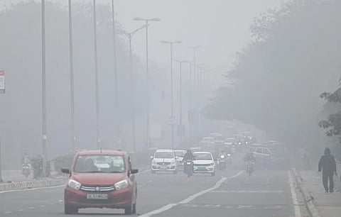 Commuters drive amidst morning smog (Photo | Shekhar Yadav, EPS)