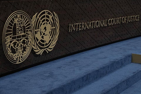 The logo of the International Court of Justice and that of the UN are seen on the judges' bench as preliminary hearings opened in Armenia's case against Azerbaijan, Oct. 12, 2023. (Photo | AP)