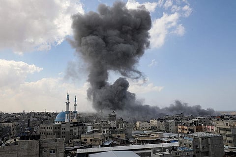 Smoke billows during Israeli air strikes in Gaza City on October 12, 2023 as raging battles between Israel and the Hamas movement continue for the sixth consecutive day. (Photo | AFP)
