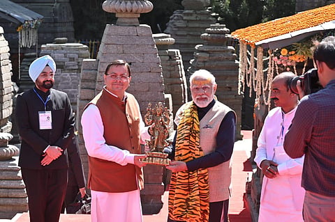 Chief Minister Shri Pushkar Singh Dhami presented a photo of Om Parvat, angvastra to the Prime Minister. (Photo | Special Arrangement)
