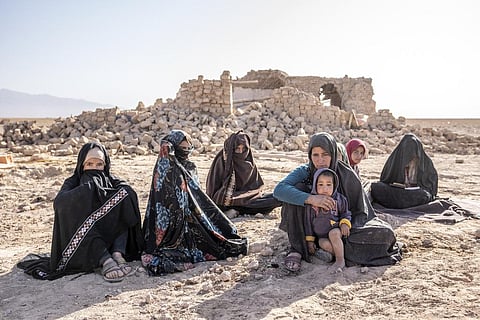FILE: Afghan women sit in front of their houses that were destroyed by the earthquake in Zenda Jan district in Herat province, western of Afghanistan, Wednesday, Oct. 11, 2023. (Photo | AP)