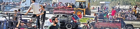 Palestinians fleeing from northern Gaza to the south with their belongings after the Israeli evacuation order | AP