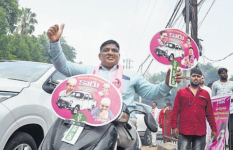 A BRS worker in a jubilant mood ahead of the release of BRS’ election manifesto in Banjara Hills, Hyderabad, on Sunday | Sri Loganathan Velmurugan