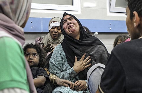 Wounded Palestinians at the al-Shifa hospital, following Israeli airstrikes on Ahli Arab hospital in Gaza City (Photo | AP)