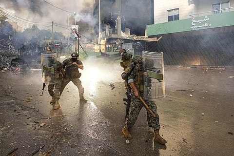 Lebanese army soldiers clash with protesters during a demonstration, in solidarity with the Palestinian people, near the US embassy in Beirut, Wednesday, Oct. 18, 2023. (Photo | AP)