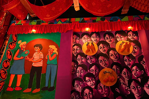 A community 'puja pandal' themed on 'surrogacy' during Durga Puja festival, in Kolkata. (Photo | PTI)