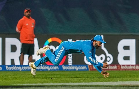 India's Virat Kohli takes catch of New Zealand's Mark Chapman during the ICC Men's World Cup ODI cricket match between India and New Zealand at the HPCA Stadium in Dharamshala. (Photo | PTI)