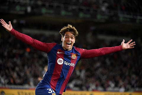 Barcelona's Spanish forward #38 Marc Guiu celebrates after scoring his team's first goal during the Spanish league football match between FC Barcelona and Athletic Club Bilbao. (Photo | AFP)