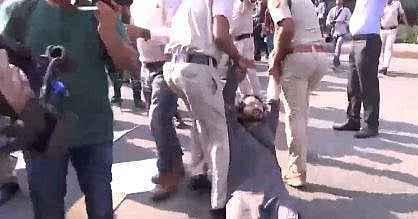 A student being dragged by Delhi police during SFI's protest in the national capital | Video screengrab