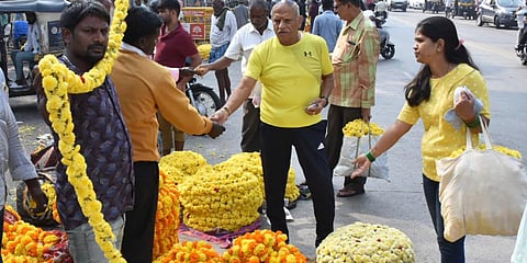 Rush at the market  for festival purchases ahead of ayudha puja and Vijayadashami in Mysuru on Sunday.   (Photo  | Udayashankar S)