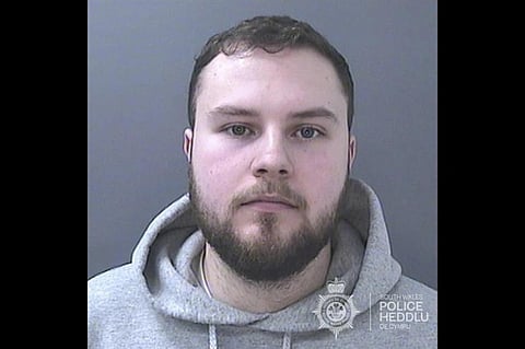 Lewis Edwards, a former British police officer sentenced to life in prison after he pleaded guilty to over 100 child sex offenses.  (Photo | South Wales Police, via AP)