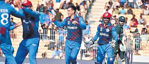 Afghanistan players celebrate the loss of a  Pakistani wicket during the ODI world game in Chennai. (Photo, P Ravikumar EPS)