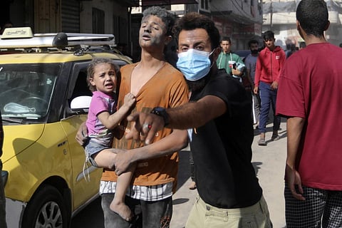 Injured Palestinians are evacuated following Israeli airstrikes in Khan Younis, southern Gaza Strip, Thursday, Oct 26, 2023. (Photo | AP)