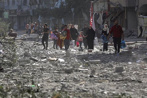 Palestinians leave their homes following Israeli bombardment on Gaza City, Monday, Oct. 30, 2023. (Photo | AP)