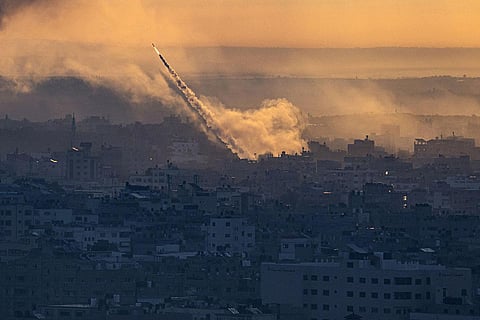Without warning, on Saturday, Gaza's militant Hamas rulers attacked Israel by air, land and sea. Millions of Israelis in the country's south awoke to the searing sound of incoming rockets and the inevitable thud of impact. In an unprecedented escalation, armed Hamas fighters blew up parts of Israel's highly fortified separation fence and strode into Israeli communities along the Gaza frontier, terrorizing residents and trading fire with Israeli soldiers. (Photo | AP)