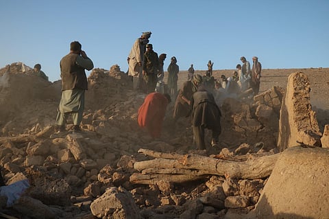 Afghan residents clear debris from a damaged house after an earthquake in Sarbuland village of Zendeh Jan district of Herat province on October 7, 2023 (AFP)
