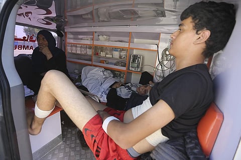 Palestinian ambulances with people wounded in the Israeli bombing of the Gaza Strip arrive at the border crossing with Egypt on Wednesday. (Photo | AP)
