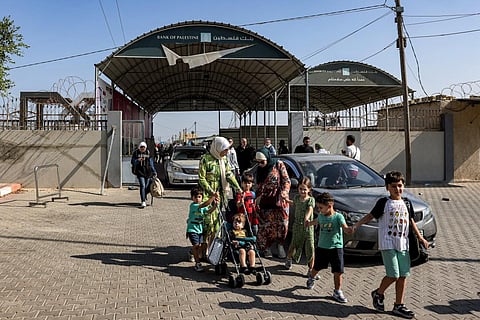 People enter the Rafah border crossing in the southern Gaza Strip before crossing into Egypt on November 1, 2023. (Photo | AFP)