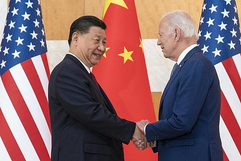 FILE - US President Joe Biden (R) and Chinese President Xi Jinping shake hands before a meeting on the sidelines of the G20 summit meeting on Nov. 14, 2022, in Bali, Indonesia. (Photo | AP)