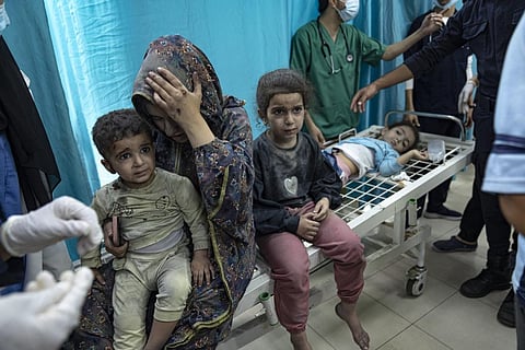 Palestinians wounded in Israeli bombardment of the Gaza Strip are brought to a hospital in Khan Younis, Sunday, Nov. 12, 2023. (AP)