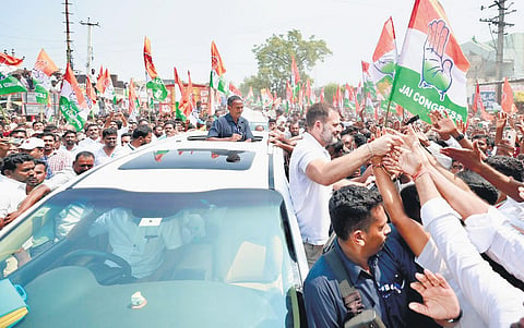 AICC leader Rahul Gandhi greets Congress workers during a roadshow in Jagtial district, October, 2023.