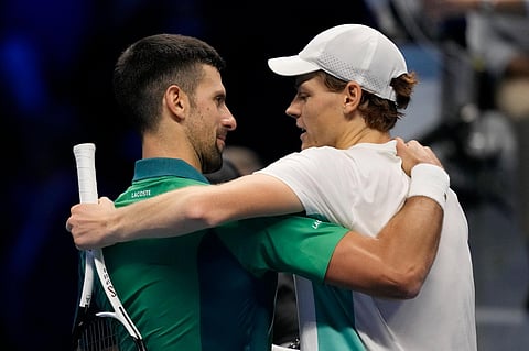 Italy's Jannik Sinner (right), embraces Serbia's Novak Djokovic at the end of the singles tennis match of the ATP World Tour Finals on Tuesday, November 15, 2023. (Photo | AP)