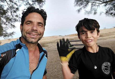 Ofer Kalderon (L) and his son Erez were taken hostage when Hamas militants rampaged through Kibbutz Nir Oz on Oct. 7. (Photo | AP)