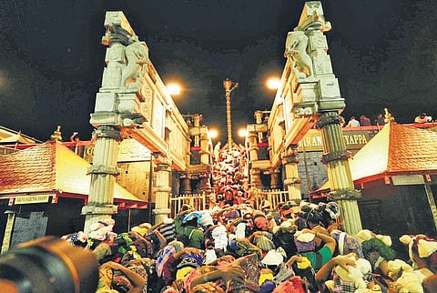 Devotees ascending 18 holy steps at the hill shrine in Sabarimala | Shaji  Vettipuram