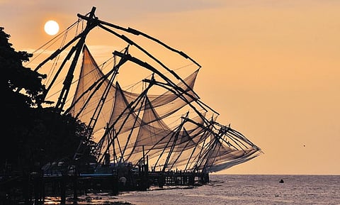 Fort Kochi’s famed Chinese nets set against a backdrop of the setting sun. (Photo | A Sanesh)