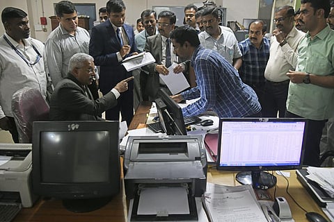 Lokayukta Justice BS Patil (seated) at the office of the Deputy Director of Land Records of Bengaluru Urban District in Benglauru on Monday  | Vinod Kumar T